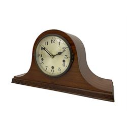 Sapele Mahogany cased tambour mantle clock c1950 with a three-train chiming movement, chiming the quarters on 5 gong rods, with a silvered dial, Arabic numerals, minute track and steel spade hands, strike/silent facility. With pendulum.



