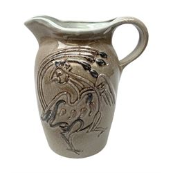 Studio pottery jug with applied decoration in the form of a bird on a brown ground H24cm