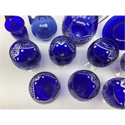 Bristol blue glass jug, together with blue claret jug, saucer, blue cut water jug, and seven matching glasses, water jug H22cm