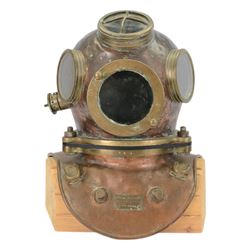 19th century Franz Clouth three bolt copper and brass diving helmet, inscribed 'Franz Clouth Kncinische Gummiwaarenfabrik m b H COLN NIPPES', matching numbers T A 7 on top and corselet rims, with handmade wooden stand, together with a reference book 'Diving Helmets' by Anthony Pardoe, which features the helmet on pages 146 and 147, helmet W42cm, H40cm, H50cm
