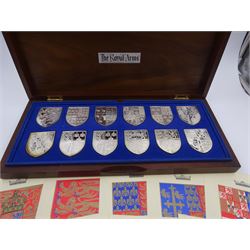 Yorkshire Mint, The Royal Arms Collection, twelve shield shaped silver medallions each depicting variations on the Royal coat of arms, each hallmarked Yorkshire Mint, Birmingham 1976/77, contained within fitted wooden case with associated information cards