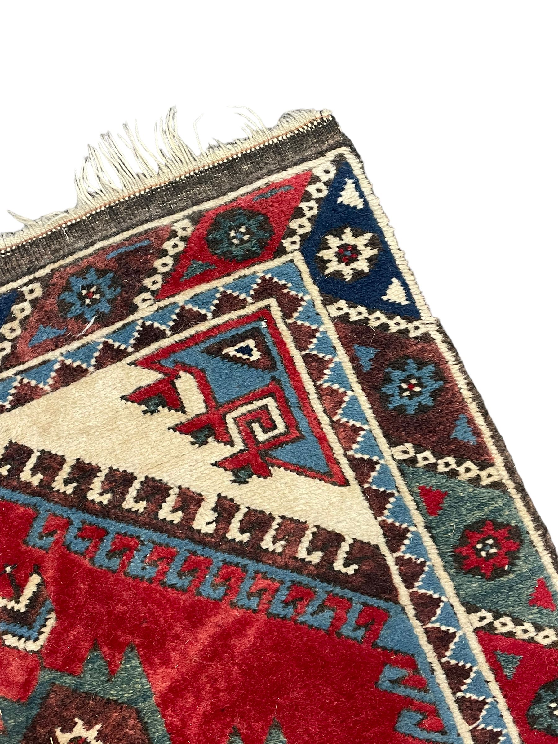 Turkish red ground runner, seven star and leaf decorated medallions, geometric design repeating border
