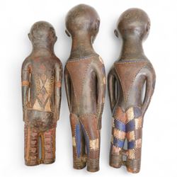  Family group of three terracotta Kouyou figures, Democratic Republic of the Congo representing father, mother and child, tallest 57cm