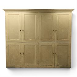 Large Georgian painted pine housekeepers cupboard, projecting cornice with four sets of tw...