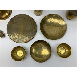 Collection of Eastern brassware to include planter, bells, dishes, mortar, gong, etc, many having engraved decoration (11)