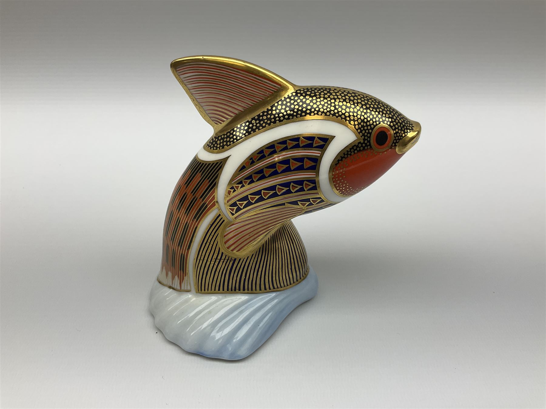 Royal Crown Derby tropical fish paperweight in the form of a Guppy, with a silver stopper, and Royal Crown Derby tortoise paperweight with gold stopper