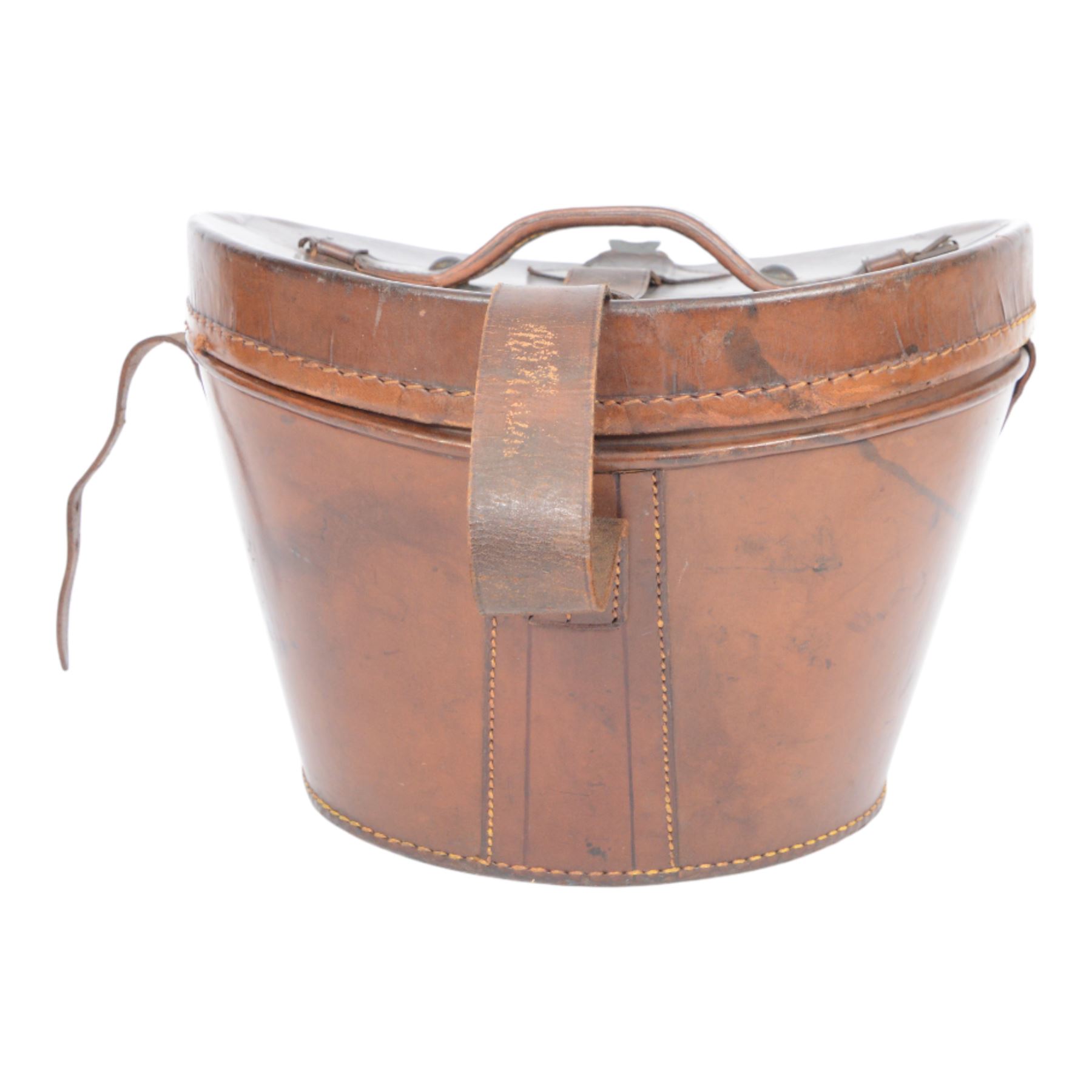 Bowler hat, by Moores, with retail label for Kendall of Scarborough, with brown leather top hat box having a handle to the lid and buckle fastening, lined in red velvet, marked W.B. to the front 