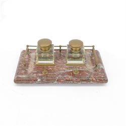 Victorian brass metal mounted red marble inkstand, the stepped rectangular base raised upon bun feet, complete with two glass ink bottles with hinged lids, H12cm