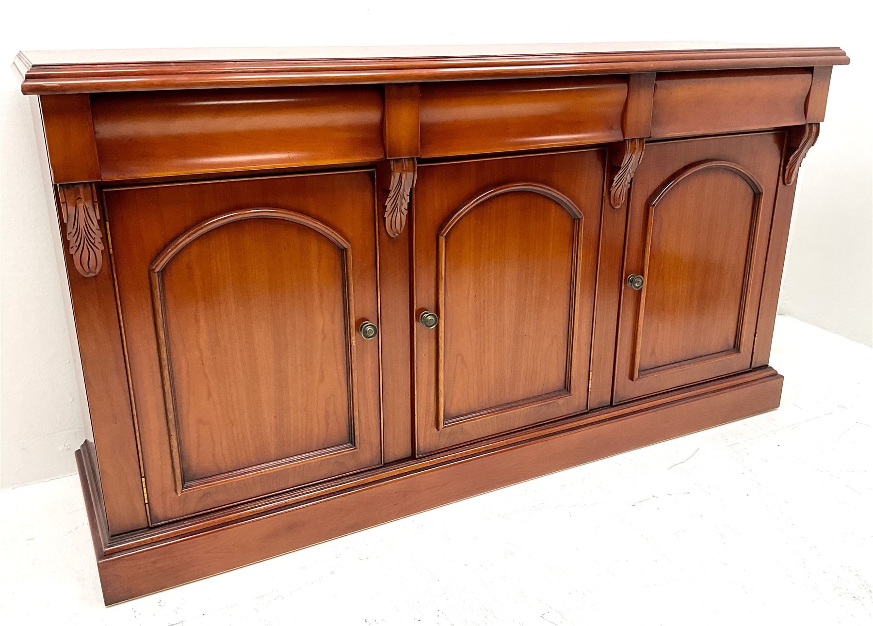 Waring & Gillow cherry wood sideboard, three drawers above three