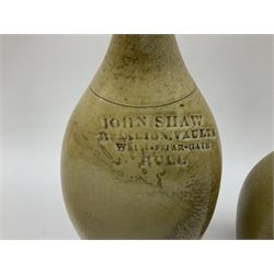  19th century salt glazed stoneware gin bottle impressed John Shaw, Red Lion Vaults, Whitefriargate, Hull of bulbous oval form H27cm and another with impressed label for J. Christie Mytongate Hull (2)  