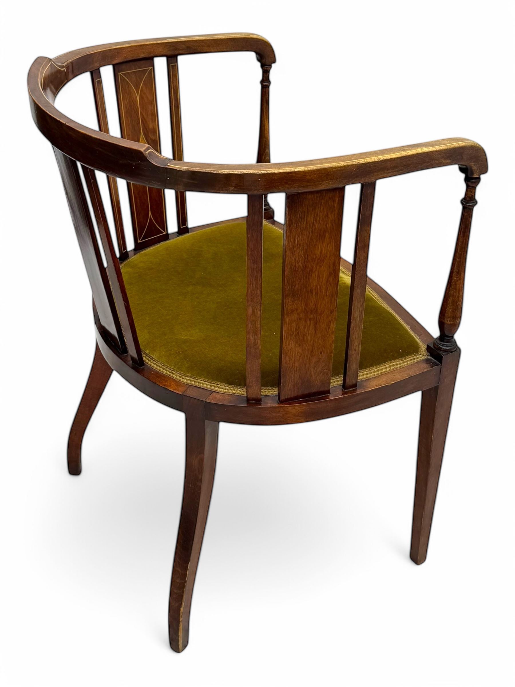 Pair of early 20th century Edwardian inlaid mahogany elbow chairs, shaped top rails with central diamond motif and line inlays, flanked by turned uprights, green velvet seats, on square tapered legs