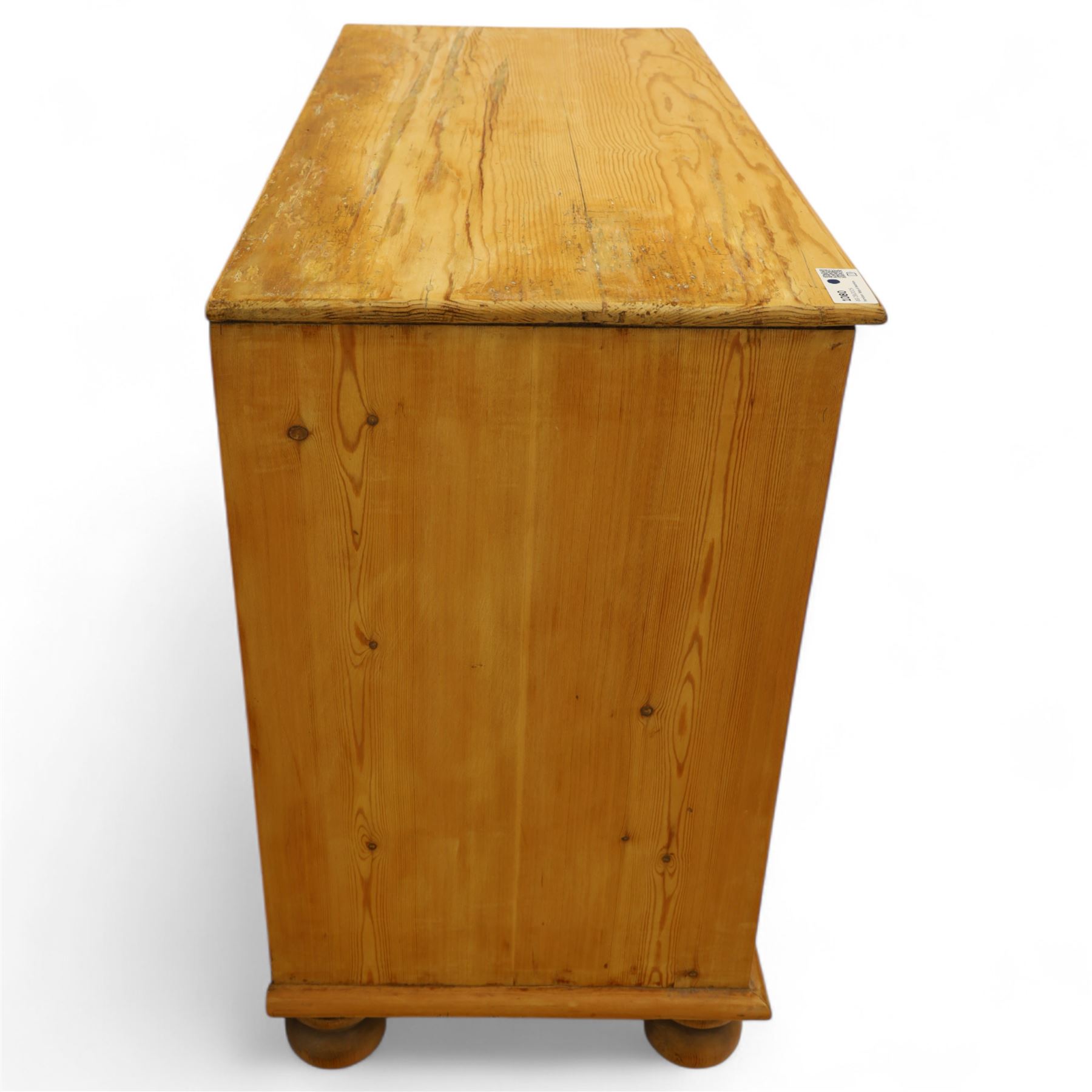 Victorian stripped pine chest, rectangular top over two short and two long drawers with turned wooden knob handles, on bun feet