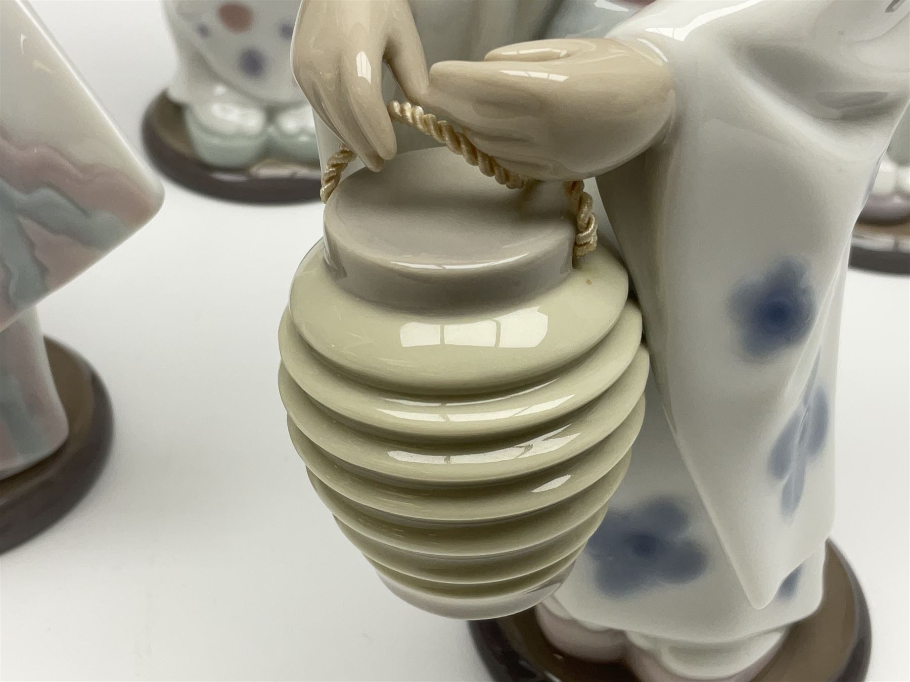 Six Lladro figures of the China doll set and Oriental doll set, comprising Playing the Flute no.6150, Bearing Flowers no.6151, Flower Gazer no. 6152, Oriental Dance no. 6230, Oriental Lantern no. 6231 and Oriental Beauty no. 6232, largest H20cm