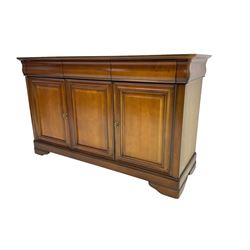 Cherry wood sideboard, fitted with three cushion drawers over three panelled cupboard doors, on bracket feet