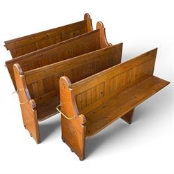 Set of four early 20th century single-ended stained pine ecclesiastical church pews, the s...
