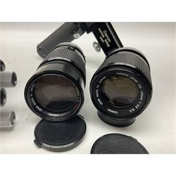 Collection of Canon lenses, to include 'Canon Lens FD 100mm 1:2.8', serial no 12821, 'Canon Lens FD 200mm 1:4' serial no 245313, 'Macro Canon Lens FL 50mm 1:3.5', serial no. 25505, 'Canon Lens FD 135mm 1:3.5 etc, together with other Canon equipment, including Bellows FL, Slide Duplicator etc 