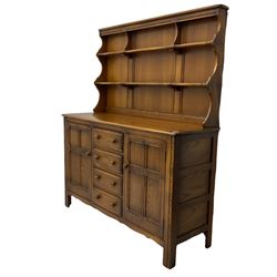 Ercol - medium elm dresser, plate rack over four drawers and two cupboards