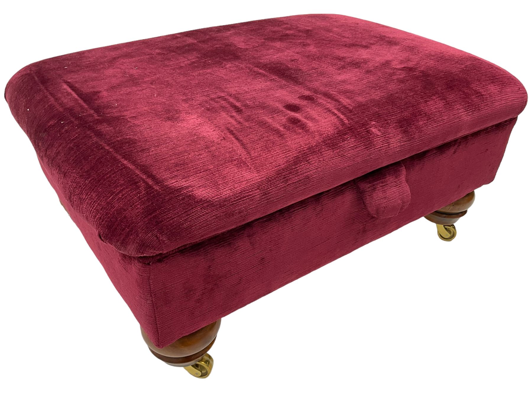 Duresta - traditional shape armchair upholstered in burgundy red velvet, on square tapering front supports (W88cm, H85cm, D103cm); together with a matching rectangular footstool with hinged seat, on turned feet with brass castors (73cm x 54cm, H38cm)