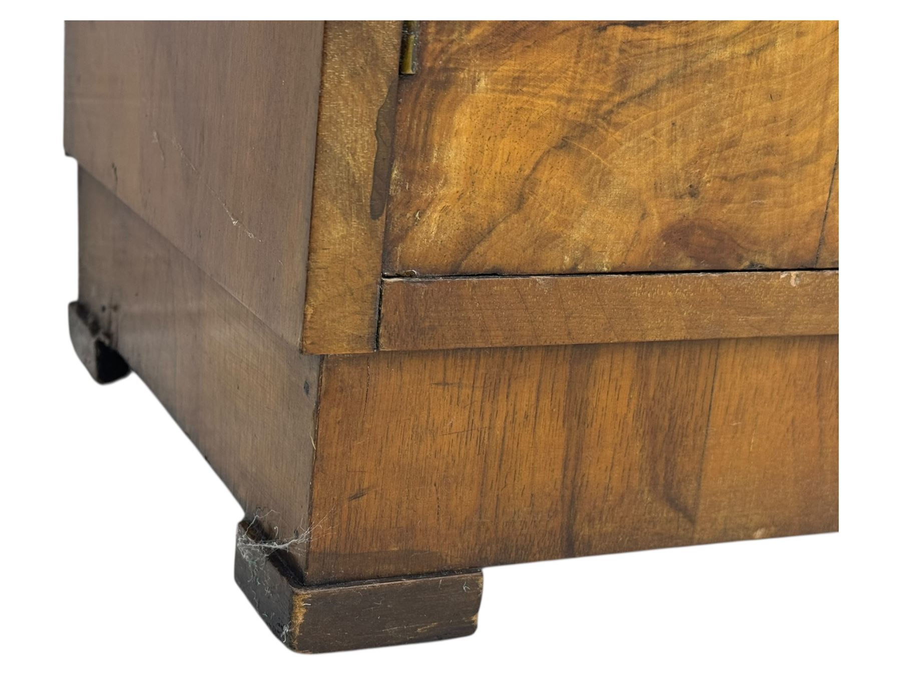 Art Deco burr walnut drinks cabinet, geometric central glazed astragal door enclosing two fixed shelves, flanked by symmetrical bookmatched veneered cupboards with drawers above 