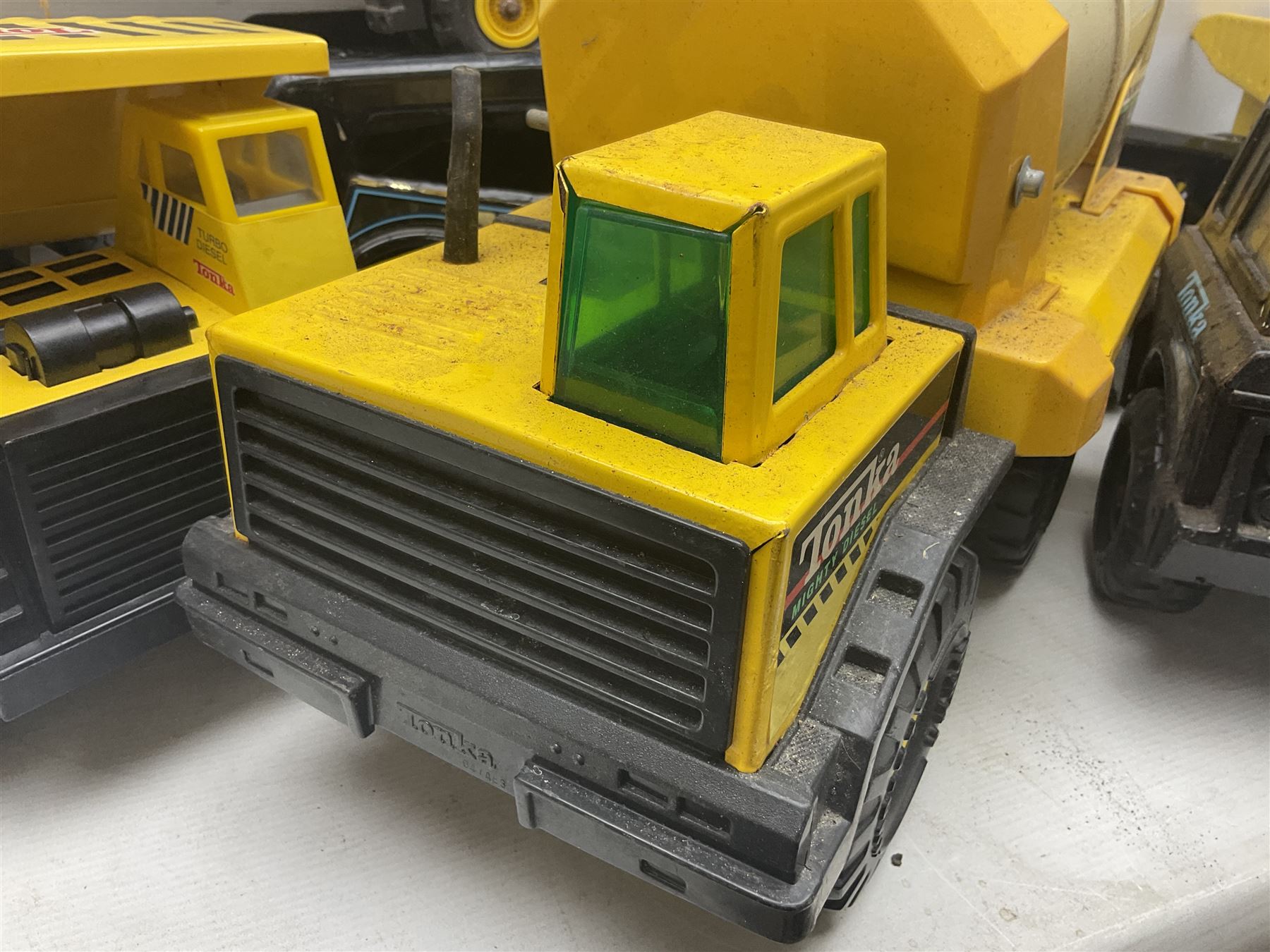Tonka - five large scale steel pressed vehicles comprising Cement Mixer, Car Transporter, Mobile Crane and two Dumper Trucks (5)