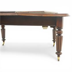 Victorian mahogany extending dining table, rounded rectangular top with moulded edge and two additional leaves, on four turned and fluted supports with brass caps and castors, extension mechanism beneath, in need of restoration