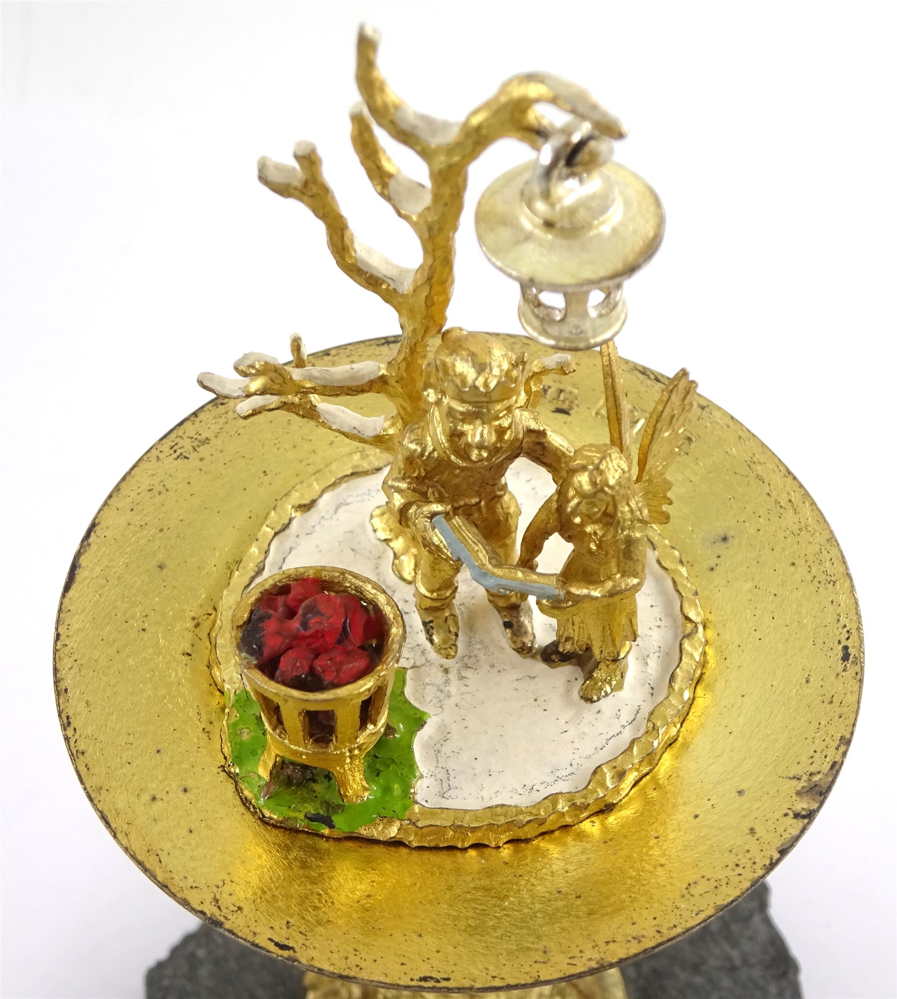 Christopher Nigel Lawrence limited edition silver and parcel gilt surprise mushroom, the textured domed cover opening to reveal two elves carolling beneath a lantern and before a fire pit set with semi-precious stones, upon a slate base, no 24/250, hallmarked Christopher Nigel Lawrence, London 1982, overall H9cm