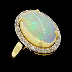 14ct gold opal and diamond cluster ring, single cabochon cut opal of approx 2.80 carat, with round brilliant cut diamond surround, stamped, total diamond weight approx 0.35 carat