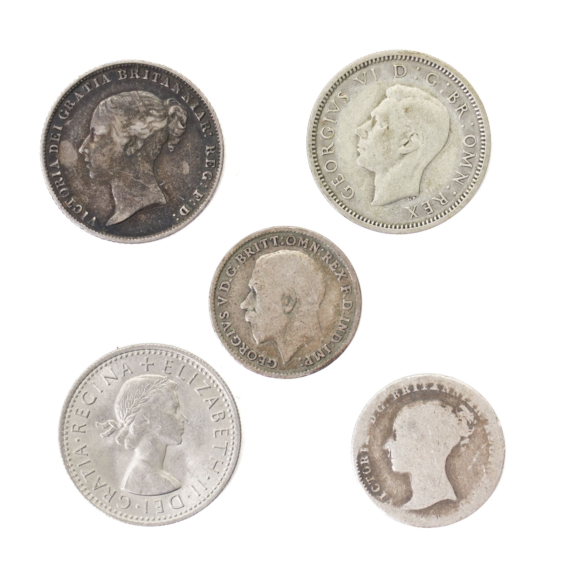Two Queen Victoria silver one crown coins, 1889 and 1890, George III 1817 silver half crown, King George V 1935 silver half crown, and seven further coins