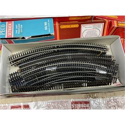 '00' gauge - quantity of unused and used track by Hornby and Peco including various curves, straights, points, diamonds, extension pack, siding sets, fixing pins etc; some boxed