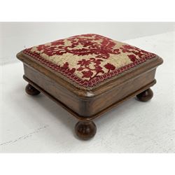 Late Victorian square oak footstool, the top upholstered in red and pale gold fabric with raised stylised floral pattern, turned feet