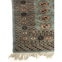 Bokhara green ground rug, geometric patterned field, repeating border, 170cm x 124cm