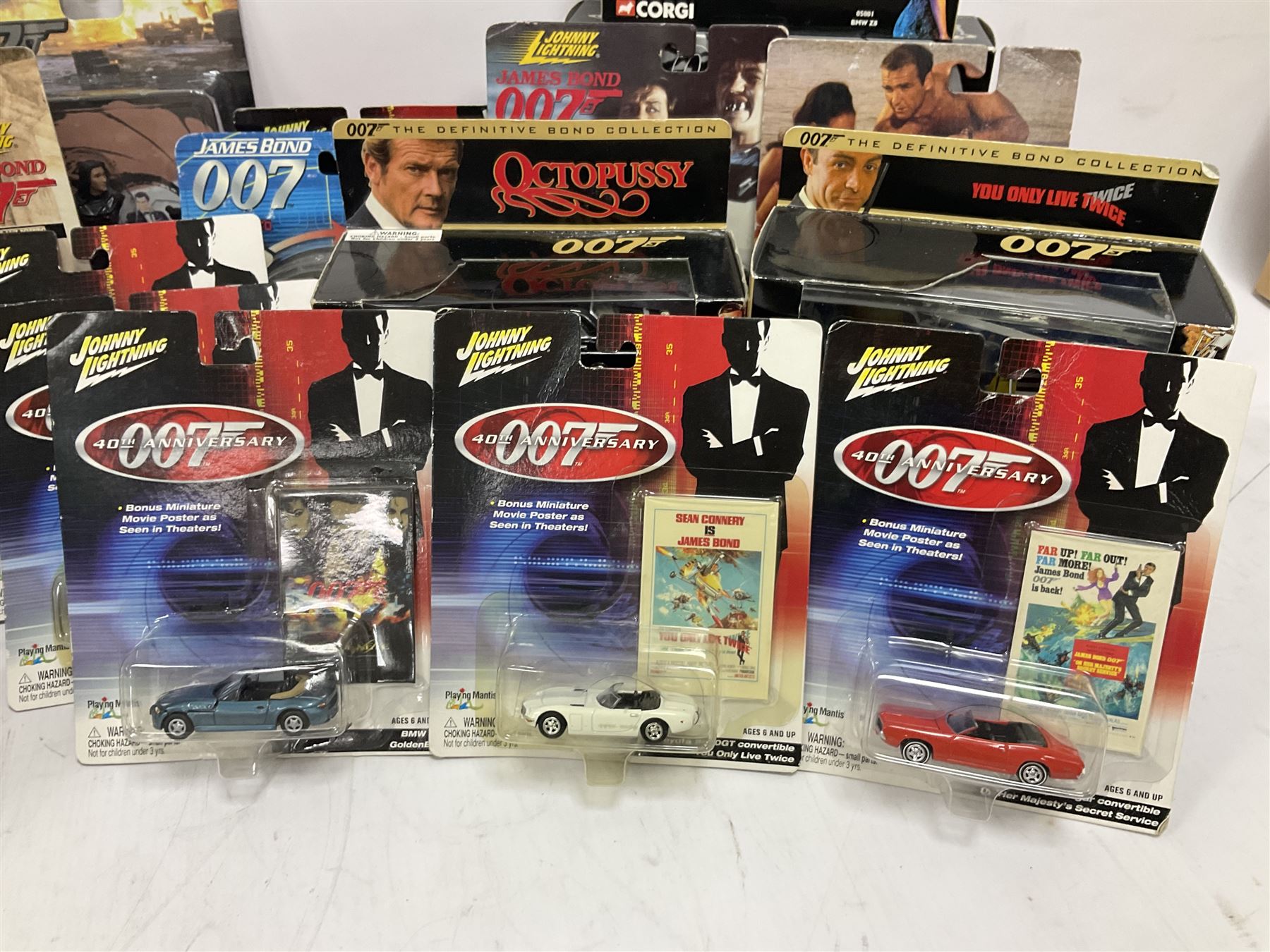 Corgi - The Definitive Bond Collection and The Director's Cut - nine die-cast vehicles from You Only Live Twice, Goldfinger, For Your Eyes Only, Diamonds Are Forever etc; Corgi Classics Moonraker Shuttle and Lotus Esprit; two other Corgi James Bond packs; Carrera Die Another Day Aston Martin V12 Vanquish; nine Johnny Lightning carded James Bond vehicles; Dragon carded Wai Lin figure; and three Fabbri tanks; all boxed/packaged (27)