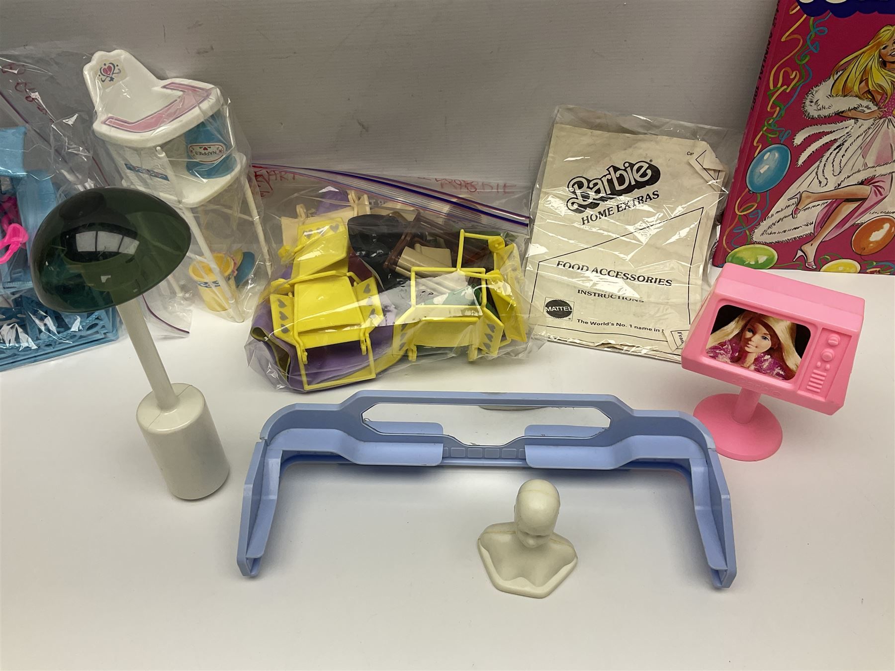 Barbie - collection of 1980s accessories including furniture and outside effects, Fluff the kitten, baby's high chair, playset and nursery items, groceries, crockery, pots and pans, homewares, television, 1985 Annual, transistor radio etc; all unboxed