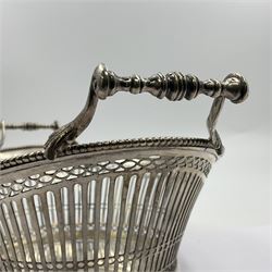 Early 20th century Dutch silver basket, of oval form with pierced sides, beaded rim, and twin handles, marked with Lion Passant for 2nd standard purity and date letter for 1910, other marks worn and indistinct, including handles H8.5cm L25.5cm