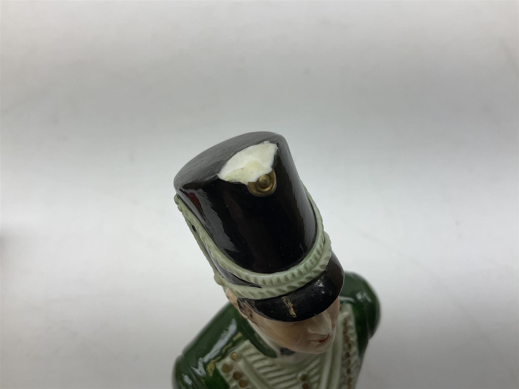 Group of Napoleonic busts comprising ‎Rudolf Kämmer Volkstedt examples of General Jean Lannes, 1st Duc de Montebello and Scottish Highland Infantry soldier and Rifleman 1803, all with blue crowned K marks beneath, and a bust of Napoleon raised upon square plinth, tallest H12cm