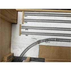 'Z' gauge continental scenic layout with folding legs, various loops of track and sidings with overhead cables, buildings including water tower, tunnels, roads with motor vehicles and figures, trees, haven with boats, backdrop diving wall hiding control units 150 x 50cm