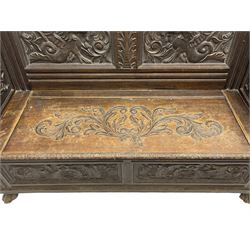 19th century oak hall bench, dentil cresting rail over moulded frame with panelled back carved with fire-breathing mythical beasts and central acanthus leaf motif, scroll carved down-sweeping arms carved with grotesque masks with scrolled foliage and shells, hinged box seat carved with scrolling foliage over panelled front with further carved foliage decoration, on paw carved front feet 