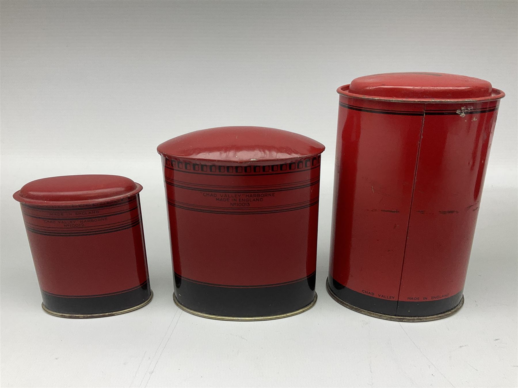 Collection of tin plate money boxes in the form of Royal Mail post boxes, to include four Chad Valley examples, one with key and others similar,  marked VR, GR and ER (10)