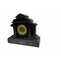 19th century Belgium slate mantle clock with an eight-day French rack striking movement striking the hours and half-hours on a coiled gong, dial with an enamel chapter ring and a gilt recessed centre, hours in upright Arabic numerals and minute markers, with steel Fleur de Lys hands, brass bezel and bevelled glass, case with recessed circular pillars in rouge marble and slate capitals, on a stepped bevelled plinth with matching marble inlay and incised carving, rectangular architectural plinth with carved quadrant supports, dial inscribed “Examd by T Hyde, Sleaford”