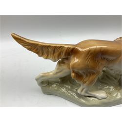 Royal Dux porcelain hunting dog with a bird, printed mark beneath, L36cm