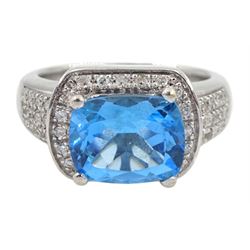 18ct white gold blue topaz and diamond cluster ring, with pave set diamond shoulders, hallmarked