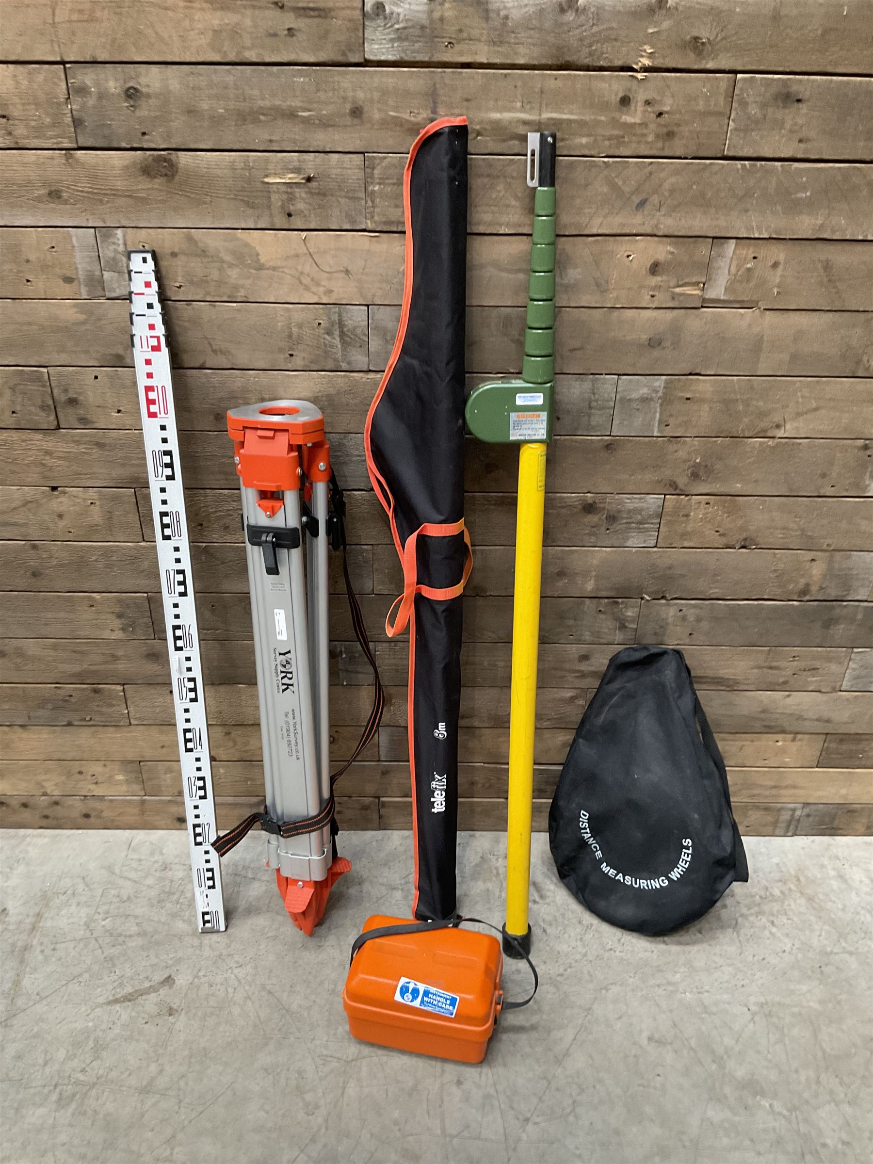 Collection of surveyors equipment including an automatic level and tripod stand and Hilka Pro Craft distance measuring wheel
