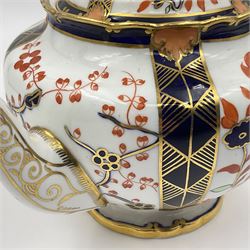 Early 20th century Royal Crown Derby teapot, decorated in a variant of the Imari pattern with blue and red prunus blossoms, with printed mark beneath including illustration date code for 1927, H14cm
