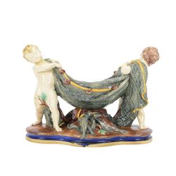 Late 19th century Copeland majolica centrepiece, circa 1874, modelled as two putto standin...