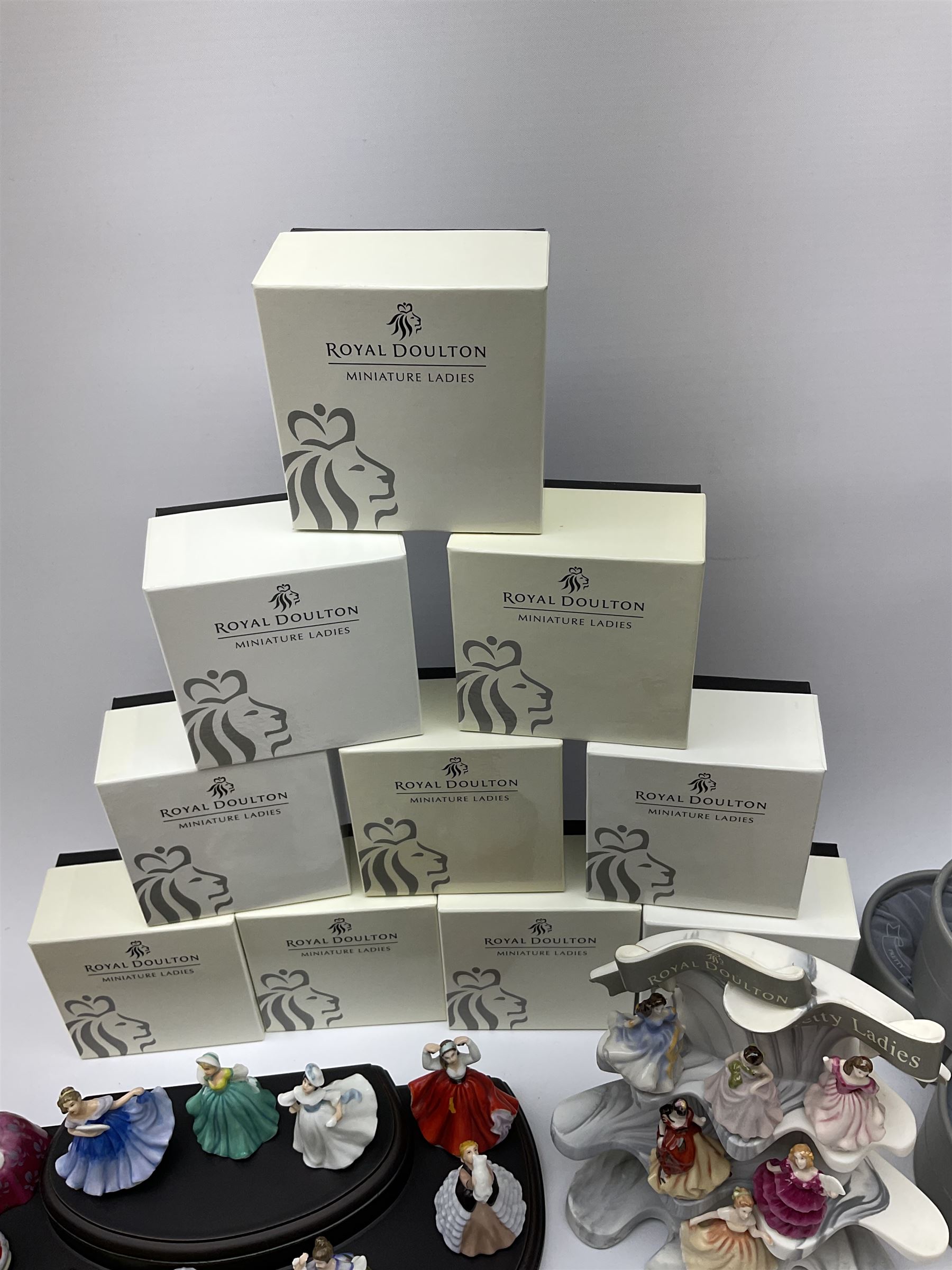 Six Royal Doulton Pretty Ladies figures, comprising Rebecca, Belle, Deborah, Jennifer, Jessica, and Lauren, with display stand, together with ten Royal Daulton Miniature Ladies figures, Ninette, Christine, Rachel, Elizabeth, Margret, Karen, Elaine, Victoria, Jane, and Susan, with display stand, all with boxes. 