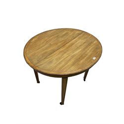 Edwardian mahogany and satinwood banded oval table, on square tapering fluted supports with brass and ceramic castors