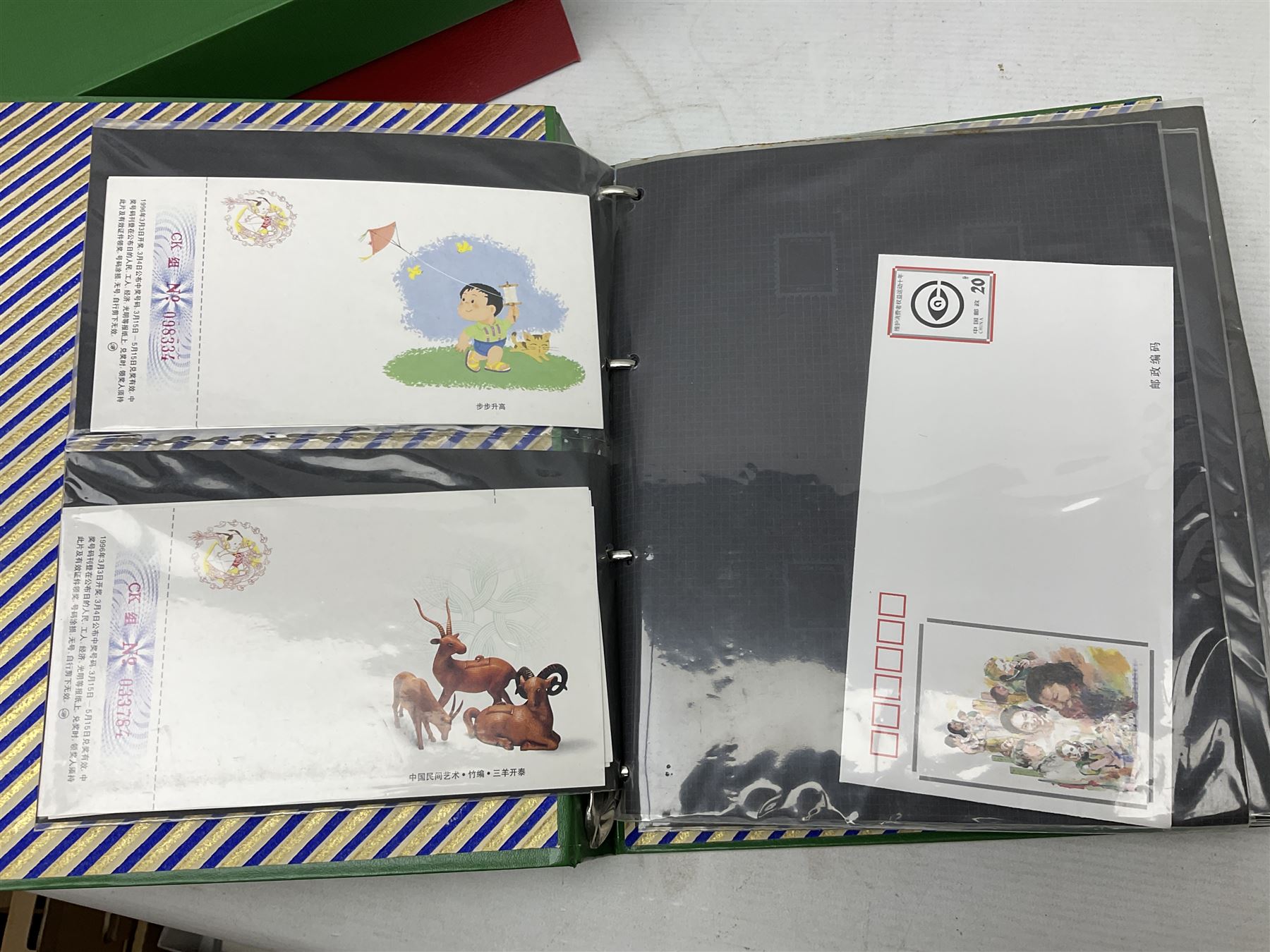 Mostly Chinese stamps including  covers and postcards, many being from the 80s and 90s, housed in ten folders