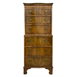Burton Reproductions walnut chest on chest, fitted with six serpentine drawers