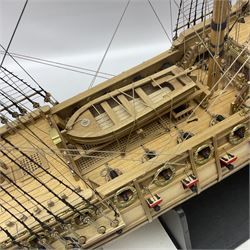 Wooden kit built model of HMS Neptune, 1:90 scale, with detailed rigging to three masts and a row of cannons to either side, upon ebonised wooden base, including stand H71cm