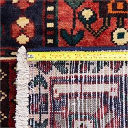 Bakhtiari wool rug, compartmented garden design field with panels of stylised trees, flowers and geometric motifs, enclosed by dark blue main border with repeating floral medallions and guard stripes